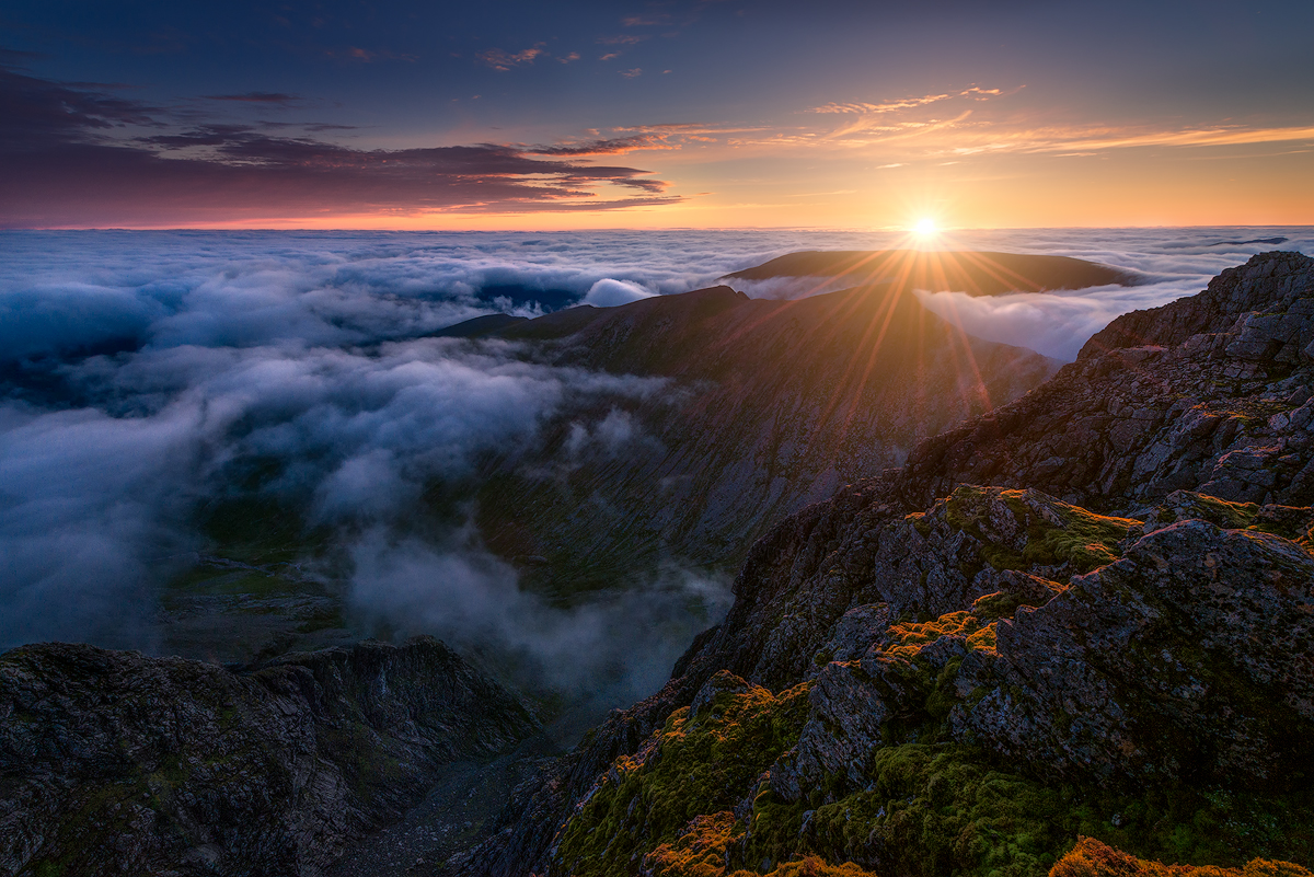 Sunrise above sea of clouds seen here from Ben Nevis