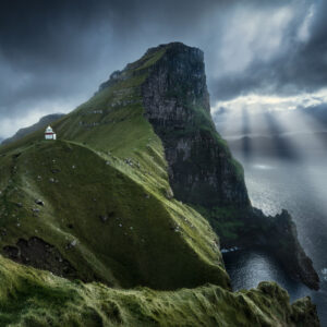 Kallur Lighthouse seems to be a tiny toy against 537m high cliff at the northernmost point on the Kalsoy Island